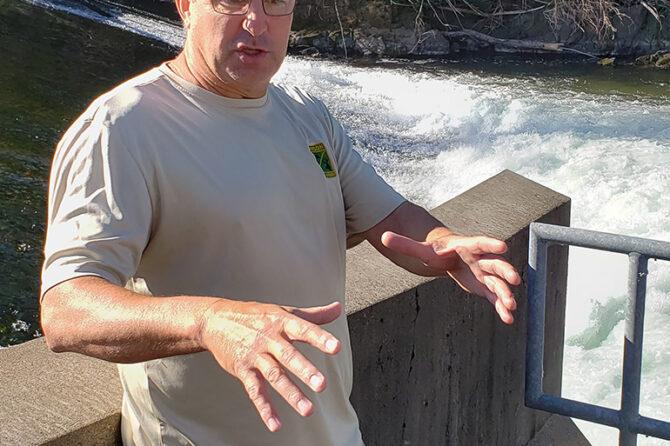 Minto fish hatchery manager Greg Grenbemer at the water barrier in the North Santiam River that routes returning salmon into the hatchery’s fish ladders.
