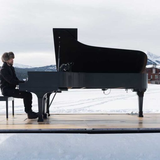 Pianist, Hunter Noack, performing his portable piano on a recent concert at Big Sky, Montana.