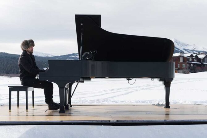 Pianist, Hunter Noack, performing his portable piano on a recent concert at Big Sky, Montana.