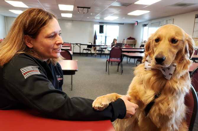 Handler Amber Cross and Probie, the first-responder therapy dog, are shown at the Sublimity Fire District station. Probie is the first such certified therapy dog in Oregon.