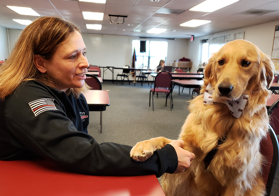Handler Amber Cross and Probie, the first-responder therapy dog, are shown at the Sublimity Fire District station. Probie is the first such certified therapy dog in Oregon.