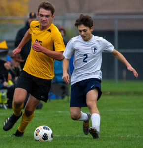 Stayton’s Jesse Wright, right, battles with Noah Aynes of Philomath for the ball during Tuesday’s boys soccer match. Wright scored the second goal in the Eagles’ 3-2 win that elevated them to No. 1 in the Class 4A rankings. 