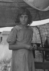 A girl captured in the lens of Depression-era photographer Dorothea Lange at a West Stayton migrant camp in the summer of 1939. Library of Congress, Prints & Photographs Division, FSA/OWI Collection, LC-USF34-020583-C
