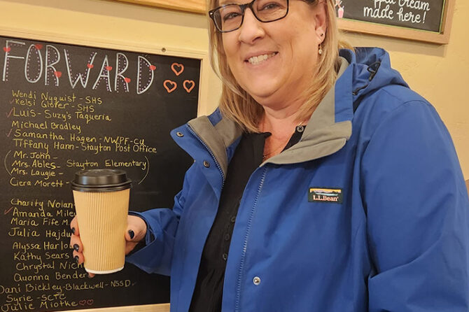 Michelle Spangler of Stayton received an anonymous Pay It Forward drink, one of many other community members – firefighters, mail carriers and even kids – who have been given a treat at Naked Cat Coffee by friends and fellow patrons. Submitted Photo