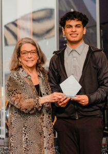 Distinguished Service – Lifetime Legacy Award recipient, Karen Andall, presenting the Future First Citizen Award to Stayton High School’s Diego Salinas.