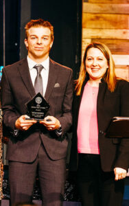 Regis High School’s Noah Koenig receiving the Future First Citizen Award from Regis Head of Schools Candi Hedrick.  