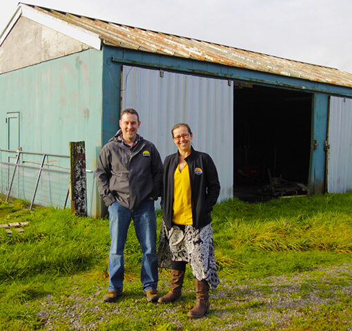 Agriculture education teacher Justin Brill and Assistant Principal Toni Wallisa are shown outside the “old barn” at Cascade High School. The school district has received a $190,000 grant that will allow it to replace the aging structure. Submitted Photo