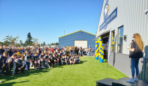 Trina Hart, mother of the late Ty Hart, speaks to the crowd gathered on Oct. 3 for the opening of the Ty Hart Memorial Fitness Center at Stayton High.        James Day