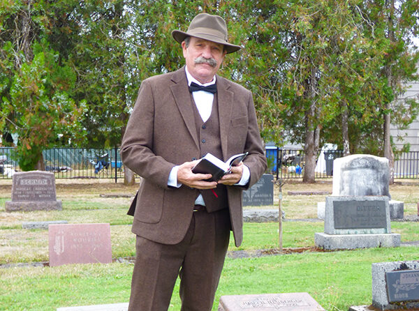 Steven Boedigheimer portraying the late Joseph Heuberger, a Sublimity hop farmer, in Saint Boniface’s Cemetery of Holy Angels. Melissa Wagoner