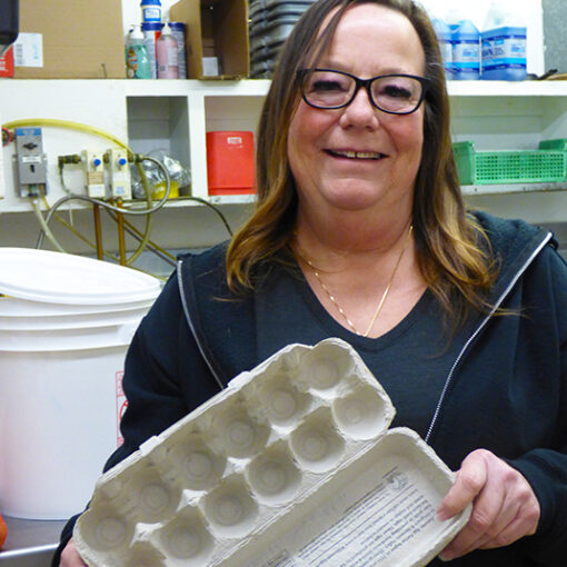 Cari Sessums, owner of The Covered Bridge Cafe, holds the evidence of the current egg shortage.