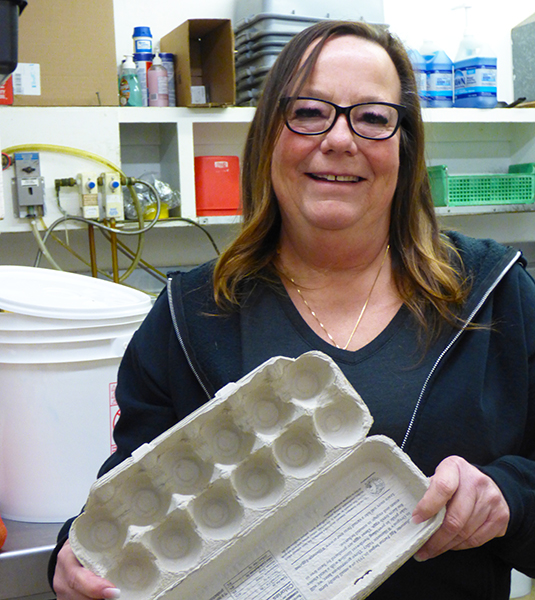 Cari Sessums, owner of The Covered Bridge Cafe, holds the evidence of the current egg shortage.