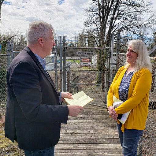 Stayton City Manager Julia Hadjuk and interim Public Works Director Barry Buchanan review a map of the city’s water infrastructure during a visit to the city’s water treatment complex. James Day