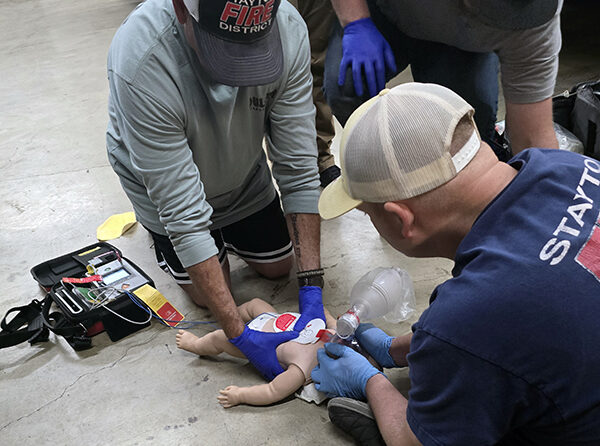Class participants practicing life-saving skills. Courtesy of Scott Cooper