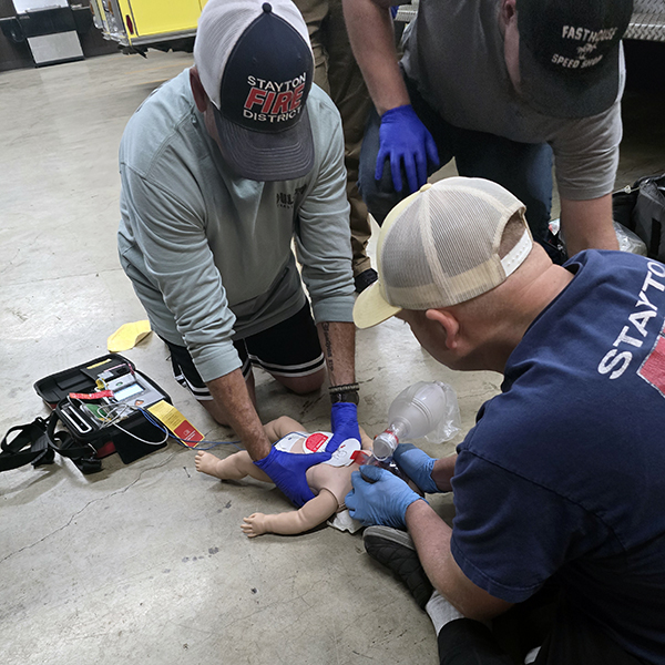 Class participants practicing life-saving skills. Courtesy of Scott Cooper